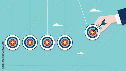 business target achievement as a milestone to achieve the next target, businessman pulling target board with bullseye arrow as e pendulum for milestone the next target