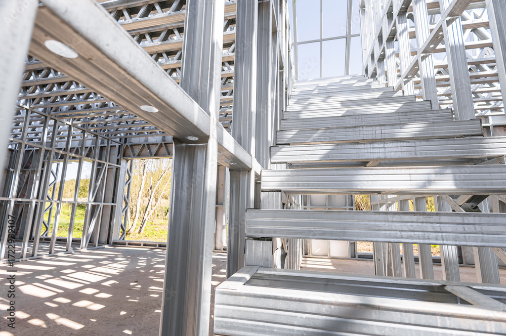 Obraz premium Steel frame commercial building under construction. The steel girder framework of a new building