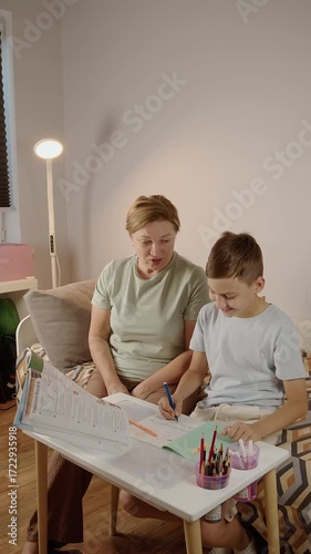 Mother helping son with school homework