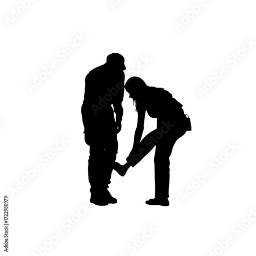 Parole officer checking parolee s ankle monitor silhouette