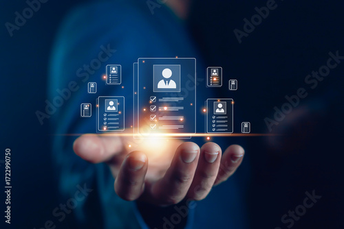 Businessman holding glowing digital resume icons, concept of recruitment technology, HR management, candidate selection, employee evaluation, job application, workforce hiring, digital acquisition,