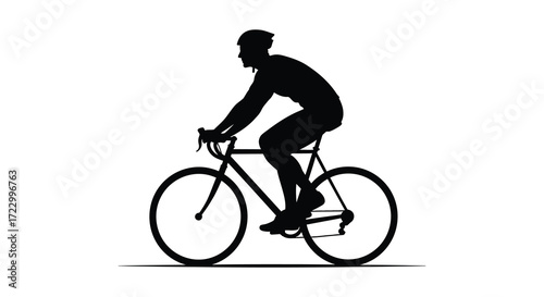 A cyclist riding a road bike in a striking black silhouette