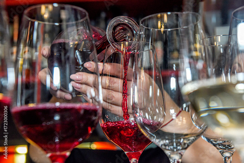 When pouring red wine into a glass