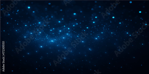 Starry blue abstract background illustrating a cosmic night sky with glowing particles and dust