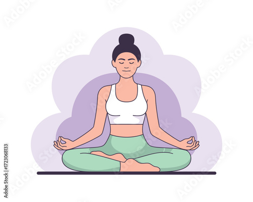 Woman meditating in lotus pose with eyes closed and calm expression