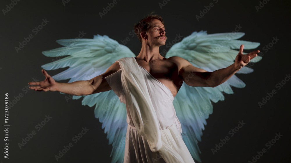 Fototapeta premium A battle angel in a white tunic, a concept in the antique style or in the style of Renaissance painting, a muscular young man