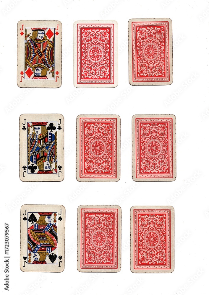 Fototapeta premium Three different hands of grubby vintage playing cards isolated on a white background.