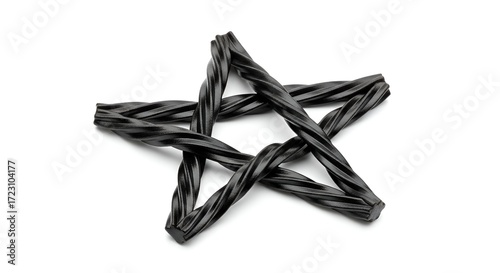 Artfully arranged black licorice candy twists forming a perfect five-pointed star shape, a delightful and classic sweet treat on a clean white background
