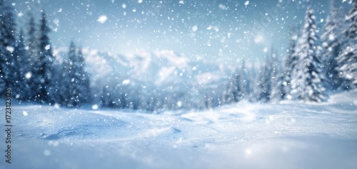 The enchanting winter landscape with falling snowflakes and majestic mountains.