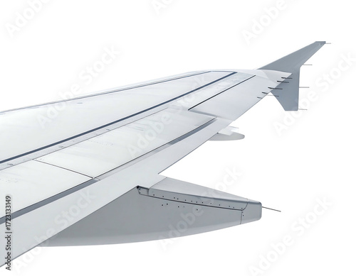 Close-up of a large, white airplane wing, showcasing its aerodynamic design, flaps, ailerons, and winglet.  Visible are numerous rivets and panel lines