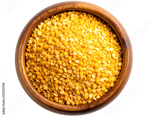 Overhead shot of a wooden bowl brimming with split yellow peas, showcasing their vibrant color and texture.  The peas are densely packed, filling the bowl completely