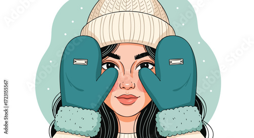 Curious young woman peeking through cozy winter mittens and warm knit hat, ready for snowy adventures