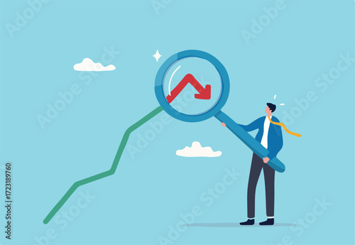 Stock market or Cryptocurrency decline, down turn or economic recession, market plunge signal, inflation or interest rate falling down concept, businessman analyst with magnifier on arrow turn down. 