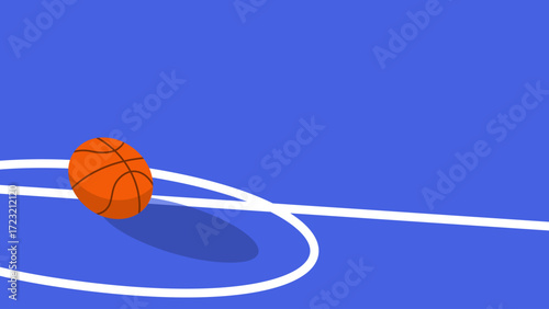 A basketball is rolling on a blue court surface.