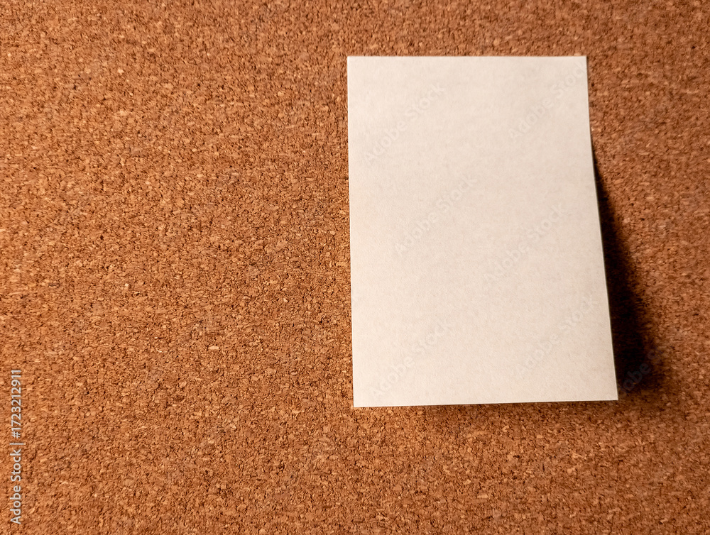Fototapeta premium Blank white sheet of paper on cork board background for message or reminder