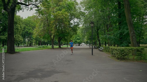 Wallpaper Mural A man does push-ups and starts jogging in the park. A young athletic man exercises in the park in the morning. Torontodigital.ca