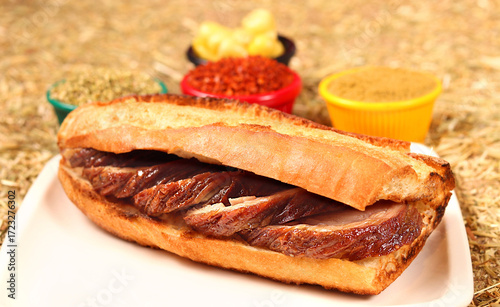 a fried kokorech sandwich