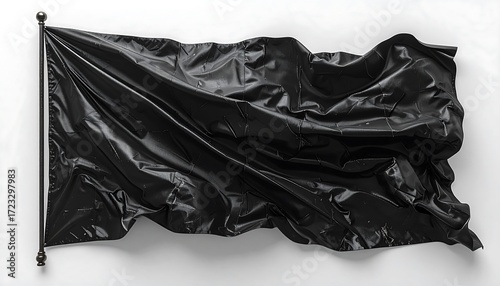 Black flag billowing on a pole
