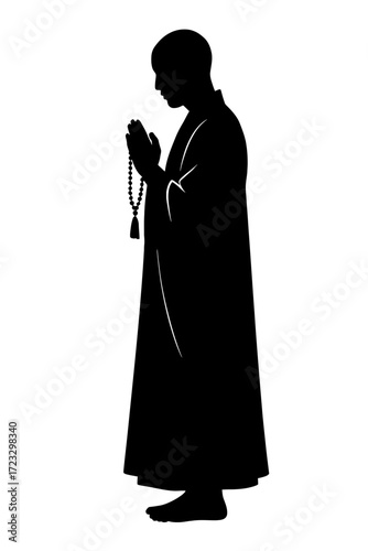 Silhouette monk praying with rosary beads spiritual meditation concept
