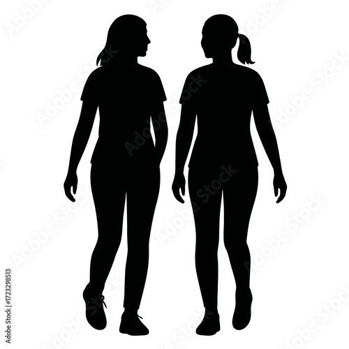 Silhouette two women walking together side by side casual clothing