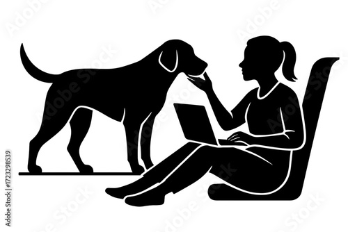 Silhouette woman working on laptop while petting dog at home