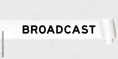 Ripped gray paper background that have word broadcast under torn part