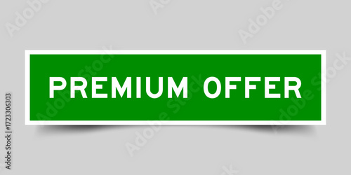 Green color square shape sticker label with word premium offer on gray background