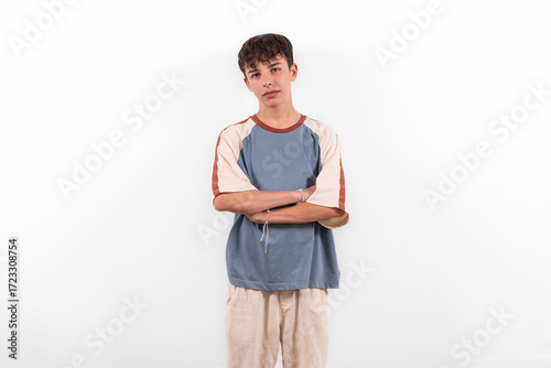 chill aloof laidback young casual dressed white male model teenage boy is too cool for school. unbothered relaxed gen z plain background studio setting