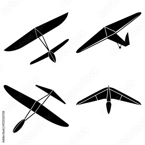 Four black silhouettes of hang gliders in different orientations against a white background plain design
