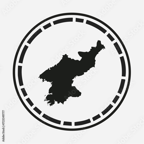 Black silhouette of north korea map inside a circle with dashed line border on a white background view