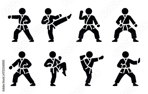 Silhouettes of martial arts poses on dark background