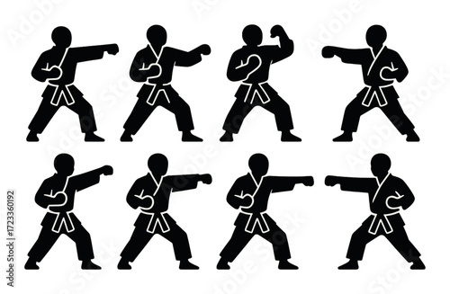 Silhouettes of martial arts figures performing karate poses on green background