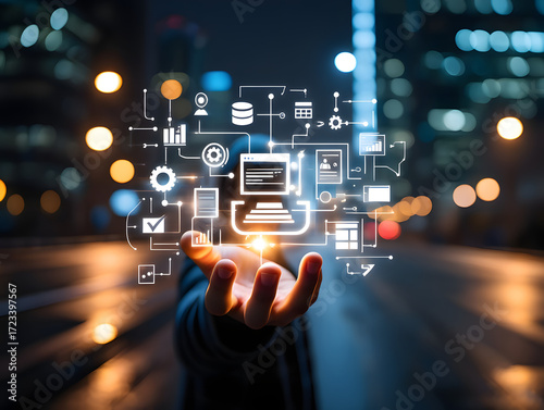 Hand holding digital network and data connections over city lights at night