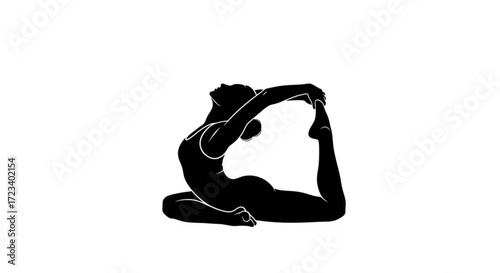 Silhouette of a woman in yoga pose the woman is bending backwards and holding her foot she is wearing a sports bra and leggings