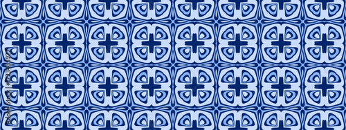 A symmetrical repeating pattern of interlocking geometric shapes in varying shades of blue for textile or wallpaper design.