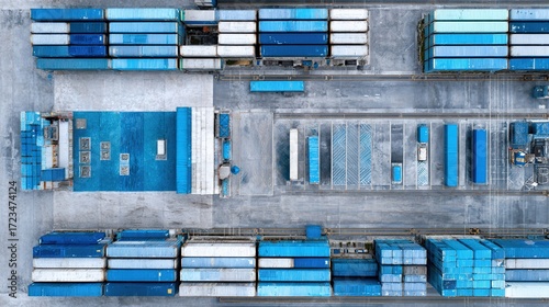 facility. An aerial view of geometric shipping containers forming an abstract industrial landscape. safety posters.