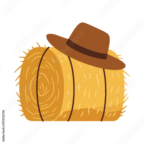 A round bale of hay with a brown cowboy hat on top, a rural farming scene.
