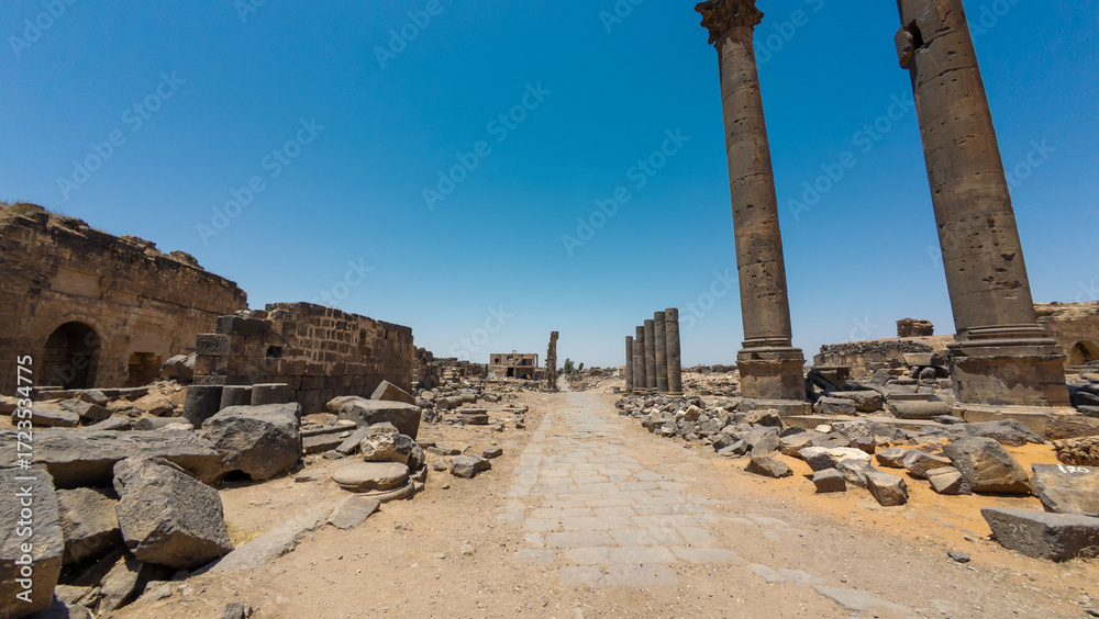 Fototapeta premium Ancient Ruins with Stone Columns Under Blue Sky