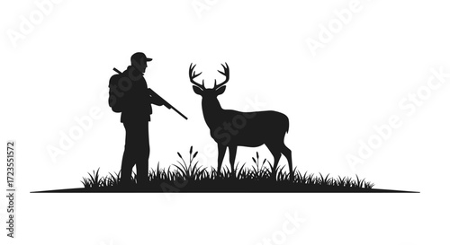 Hunter with rifle faces majestic stag in grassy field silhouette