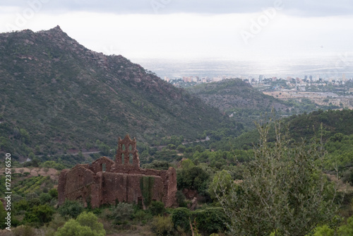 Wallpaper Mural bandoned convent in Desert de les Palmes, with Benicàssim and the sea in the background, perfect for travel, history, and atmospheric landscape photography Torontodigital.ca