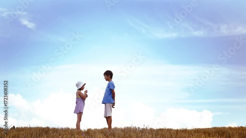 Romantic Moment: Boy Offering a Flower to Girl on Hilltop Beneath a Sky