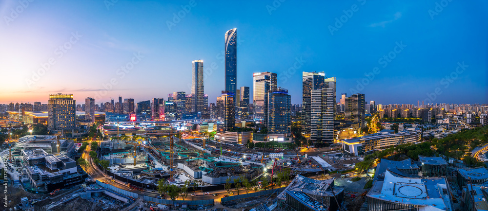Obraz premium High angle view of a modern city financial district with skyscrapers at dusk in Suzhou, China.