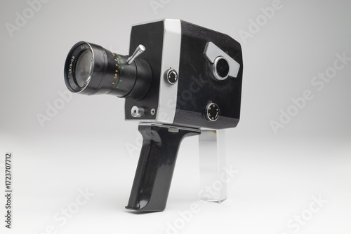 Old soviet vintage movie camera close up on gray background