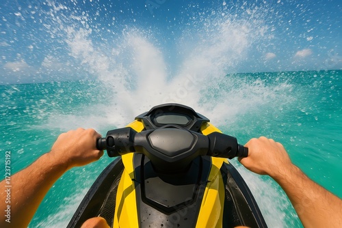 First-person view of a person riding a yellow jet ski on a turquoise ocean