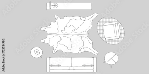 Top-down view of a living room with a sofa, cowhide rug, coffee table, and armchair