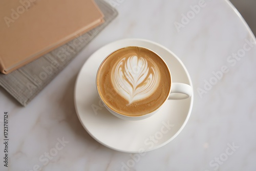 Latte art coffee cup on white marble table aesthetic cafe beverage drink cappuccino breakfast morning