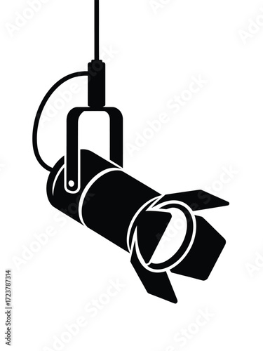 Hanging spotlight illuminating a stage or performance space