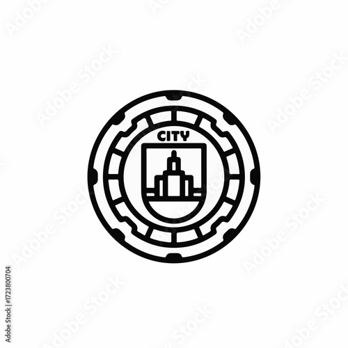 Urban communications illustrated through manhole cover icon with bold, graphic outline. Manhole cover design with minimalist city silhouette and gear details showcases utility and construction.