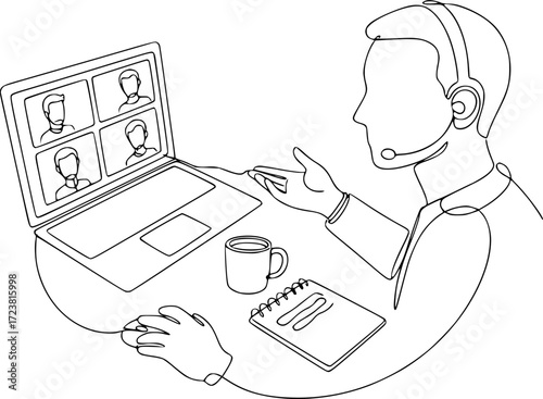 Man participating in video conference while working at laptop  