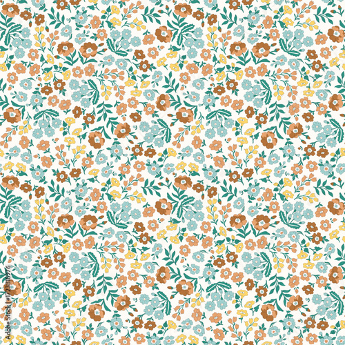 Vintage calico floral seamless pattern. Dense ditsy millefleur print with rustic country flowers in orange and blue for autumn fabric, quilting, and home decor.
